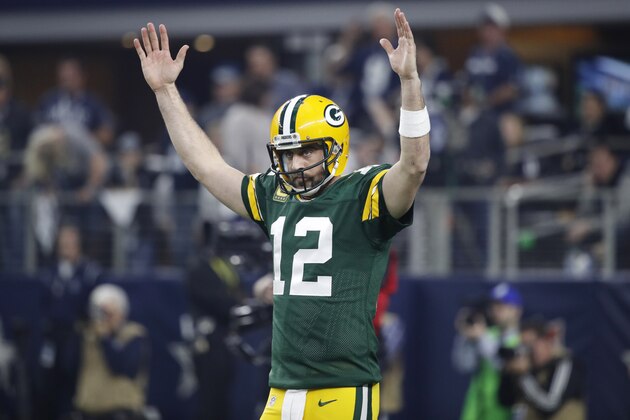 ARLINGTON, TX - JANUARY 15: Aaron Rodgers #12 of the Green Bay Packers reacts after a touchdown during the NFC Divisional Playoff game against the Dallas Cowboys at AT&T Stadium on January 15, 2017 in Arlington, Texas. The Packers defeated the Cowboys 34-31. (Photo by Joe Robbins/Getty Images)