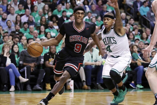 Chicago Bulls guard Rajon Rondo (9) drives towards the basket past Boston Celtics guard Isaiah Thomas (4) during the second quarter of a first-round NBA playoff basketball game in Boston, Tuesday, April 18, 2017. (AP Photo/Charles Krupa)