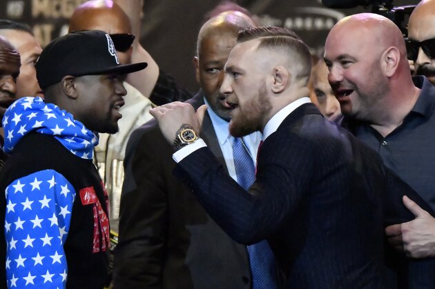 Floyd Mayweather Jr. (L) faces off for the first time with UFC fighter Conor McGregor during a press call at the Staples Center in  Los Angeles, California on July 11, 2017.
The two will fight August 26th in Las Vegas, Nevada. / AFP PHOTO / Gene Blevins        (Photo credit should read GENE BLEVINS/AFP/Getty Images)