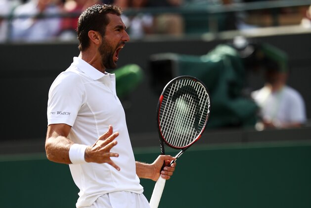 LONDON, ENGLAND - JULY 12:  Marin Cilic of Croatia celebrates match point and victory during the Gentlemen's Singles quarter final match against Gilles Muller of Luxembourg on day nine of the Wimbledon Lawn Tennis Championships at the All England Lawn Tennis and Croquet Club on July 12, 2017 in London, England.  (Photo by Julian Finney/Getty Images)