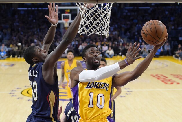 Los Angeles Lakers guard David Nwaba, right, shoots as New Orleans Pelicans forward Cheick Diallo, of Mali, defends during the first half of an NBA basketball game, Tuesday, April 11, 2017, in Los Angeles. (AP Photo/Mark J. Terrill)