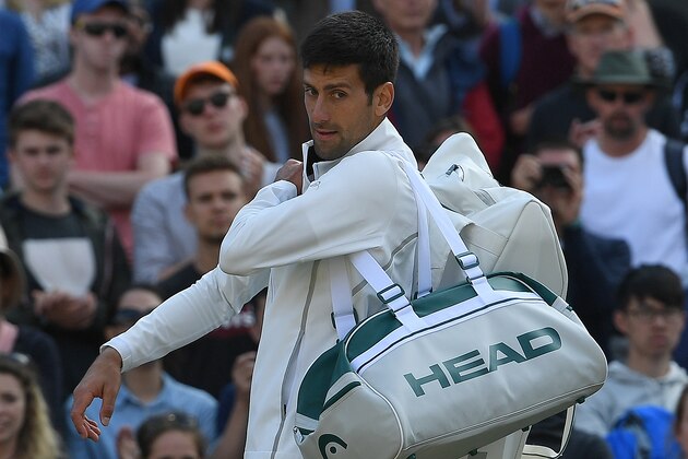 Serbia's Novak Djokovic reacts as he prepares to leave the court after retiring in his men's singles quarter-final match against returns against Czech Republic's Tomas Berdych on the ninth day of the 2017 Wimbledon Championships at The All England Lawn Tennis Club in Wimbledon, southwest London, on July 12, 2017.
Berdych won the match 7-6, 2-0. Djokovic retired in the second set. / AFP PHOTO / Glyn KIRK / RESTRICTED TO EDITORIAL USE (Photo credit should read GLYN KIRK/AFP/Getty Images) Serbia's Novak Djokovic reacts as he prepares to leave the court after retiring in his men's singles quarter-final match against returns against Czech Republic's Tomas Berdych on the ninth day of the 2017 Wimbledon Championships at The All England Lawn Tennis Club in Wimbledon, southwest London, on July 12, 2017.
Berdych won the match 7-6, 2-0. Djokovic retired in the second set. / AFP PHOTO / Glyn KIRK / RESTRICTED TO EDITORIAL USE (Photo credit should read GLYN KIRK/AFP/Getty Images)