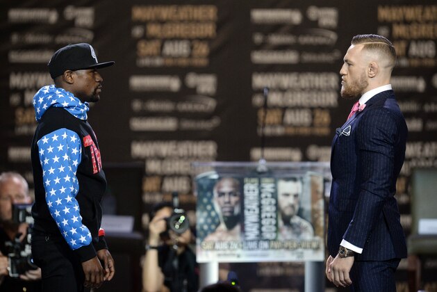 July 11, 2017; Los Angeles, CA, USA; Floyd Mayweather and Conor McGregor stare down one another during a world tour press conference to promote the upcoming Mayweather vs McGregor boxing fight at Staples Center. Mandatory Credit: Gary A. Vasquez-USA TODAY Sports