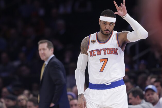 New York Knicks' Carmelo Anthony (7) checks in as Jeff Hornacek, left, watches during the first half of an NBA basketball game against the Chicago Bulls Tuesday, April 4, 2017, in New York. (AP Photo/Frank Franklin II) New York Knicks' Carmelo Anthony (7) checks in as Jeff Hornacek, left, watches during the first half of an NBA basketball game against the Chicago Bulls Tuesday, April 4, 2017, in New York. (AP Photo/Frank Franklin II)