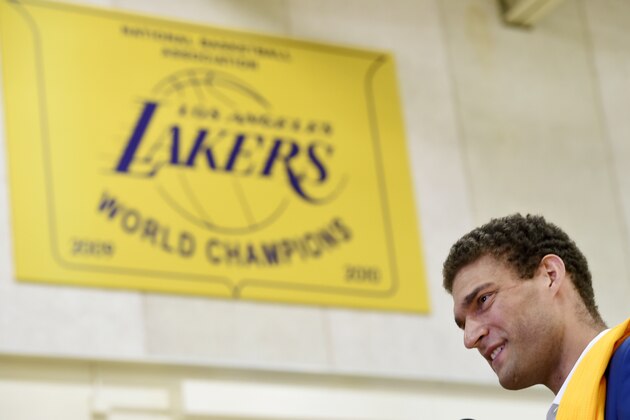 Brook Lopez, a new member of the Los Angeles Lakers, waits to be interviewed following an introductory news conference with the NBA basketball team Wednesday, June 28, 2017, in El Segundo, Calif. (AP Photo/Chris Pizzello)