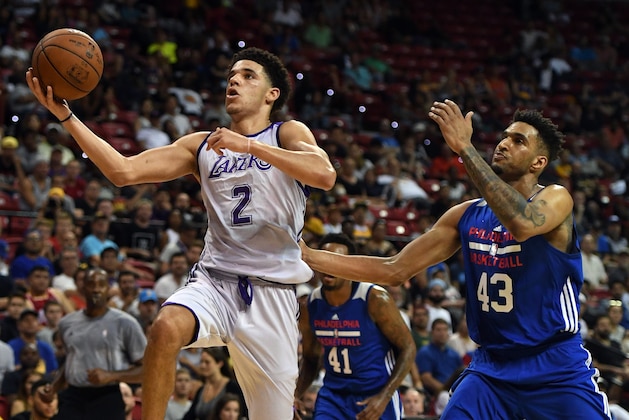 LAS VEGAS, NV - JULY 12:  Lonzo Ball #2 of the Los Angeles Lakers drives to the basket against Jonah Bolden #43  of the Philadelphia 76ers during the 2017 Summer League at the Thomas & Mack Center on July 12, 2017 in Las Vegas, Nevada. Los Angeles won 103-102. NOTE TO USER: User expressly acknowledges and agrees that, by downloading and or using this photograph, User is consenting to the terms and conditions of the Getty Images License Agreement.  (Photo by Ethan Miller/Getty Images)