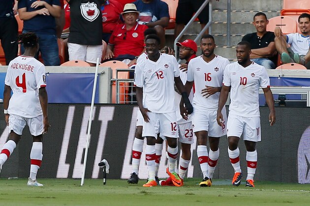 HOUSTON, TX - JULY 11:  Alphonso Davies #12 of Canada celebrates with this teammates after scoring against Canada in the first half at BBVA Compass Stadium on July 11, 2017 in Houston, Texas.  (Photo by Bob Levey/Getty Images)