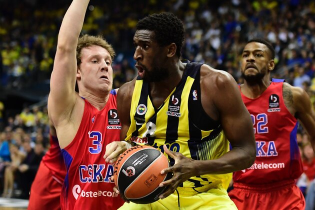 Moscow's Dmitry Kulagin (L) blocks Istanbul's Ekpe Udoh during the final basketball match CSKA Moscow vs Fenerbahce Istanbul at the Euroleague Final Four in Berlin on May 15, 2016. / AFP / John MACDOUGALL        (Photo credit should read JOHN MACDOUGALL/AFP/Getty Images)