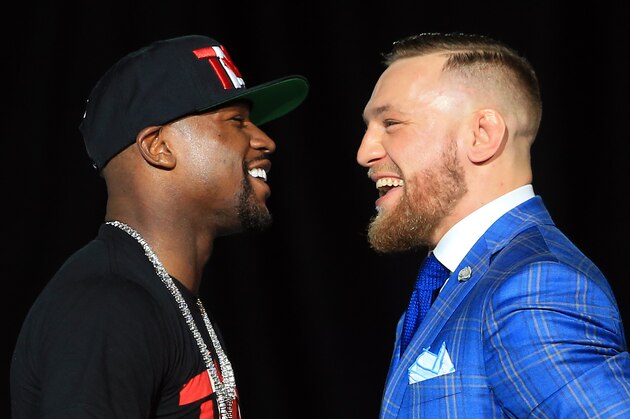 TORONTO, ON - JULY 12:  Floyd Mayweather Jr. and Conor McGregor faceoff during the Floyd Mayweather Jr. v Conor McGregor World Press Tour at Budweiser Stage on July 12, 2017 in Toronto, Canada.  (Photo by Vaughn Ridley/Getty Images)