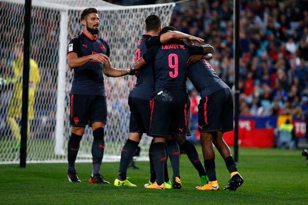 SYDNEY, AUSTRALIA - JULY 13:  Alexandre Lacazette of Arsenal celebrates scoring a goal with team mates during the match between Sydney FC and Arsenal FC at ANZ Stadium on July 13, 2017 in Sydney, Australia.  (Photo by Zak Kaczmarek/Getty Images)