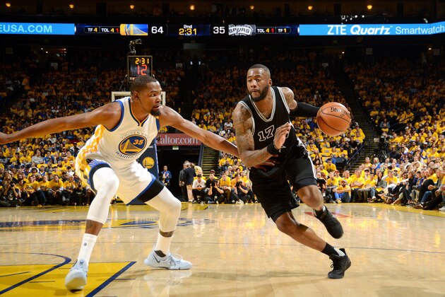 OAKLAND, CA - MAY 16: Jonathon Simmons #17 of the San Antonio Spurs drives to the basket during the game against the Golden State Warriors during Game Two of the Western Conference Finals of the 2017 NBA Playoffs on May 16, 2017 at ORACLE Arena in Oakland, California. NOTE TO USER: User expressly acknowledges and agrees that, by downloading and or using this photograph, user is consenting to the terms and conditions of Getty Images License Agreement. Mandatory Copyright Notice: Copyright 2017 NBAE (Photo by Noah Graham/NBAE via Getty Images)