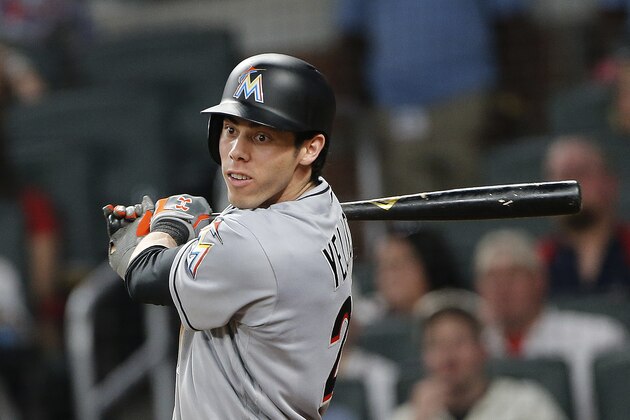 Miami Marlins' Christian Yelich (21) follows through on a two-run base hit in the ninth inning of a baseball game against the Atlanta Braves, Friday, June 16, 2017, in Atlanta. (AP Photo/John Bazemore)