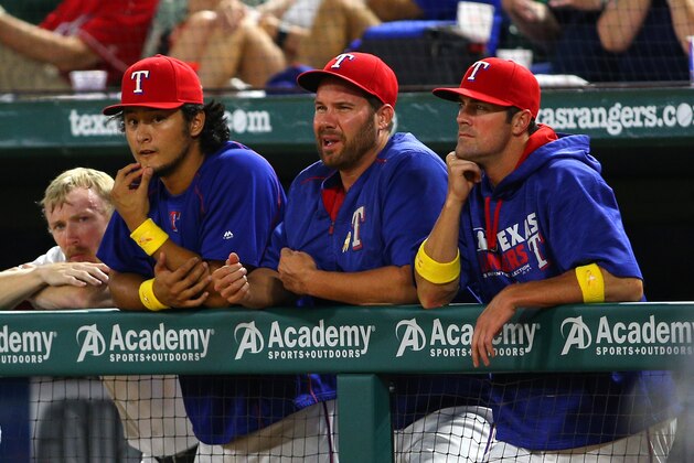 ARLINGTON, TX - SEPTEMBER 02: Yu Darvish #11 of the Texas Rangers, Colby Lewis #48 and Cole Hamels #35 looks on during in the eighth inning against the Houston Astros at Globe Life Park in Arlington on September 2, 2016 in Arlington, Texas. (Photo by Rick Yeatts/Getty Images)