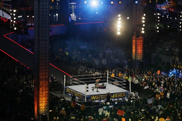 Wrestler Ryan Reeves, left, known as Ryback, stands over Mark Henry during their match Sunday, April 7, 2013, in East Rutherford, N.J., during the WWE Wrestlemania 29 event. (AP Photo/Mel Evans)