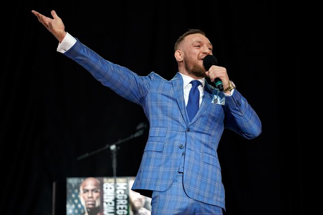 TORONTO, CANADA - JULY 12:  Conor McGregor interacts with the crowd as he speaks on stage during the Floyd Mayweather Jr. v Conor McGregor World Press Tour event at Budweiser Stage on July 12, 2017 in Toronto, Ontario, Canada. (Photo by Jeff Bottari/Zuffa LLC/Zuffa LLC via Getty Images)