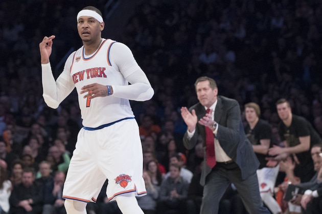 New York Knicks forward Carmelo Anthony (7) and coach Jeff Hornacek react after Anthony scored a 3-point goal during the second half of an NBA basketball game against the Denver Nuggets, Friday, Feb. 10, 2017, at Madison Square Garden in New York. The Nuggets won 131-123. (AP Photo/Mary Altaffer)