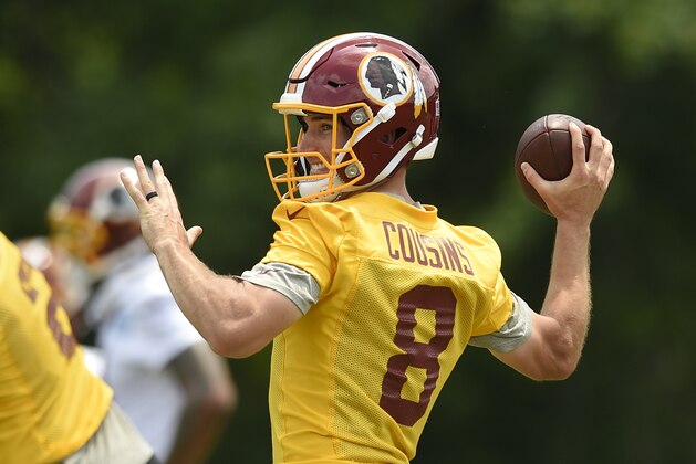 Washington Redskins quarterback Kirk Cousins (8) looks to pass during NFL football practice, Wednesday, June 14, 2017, in Ashburn, Va. (AP Photo/Nick Wass)