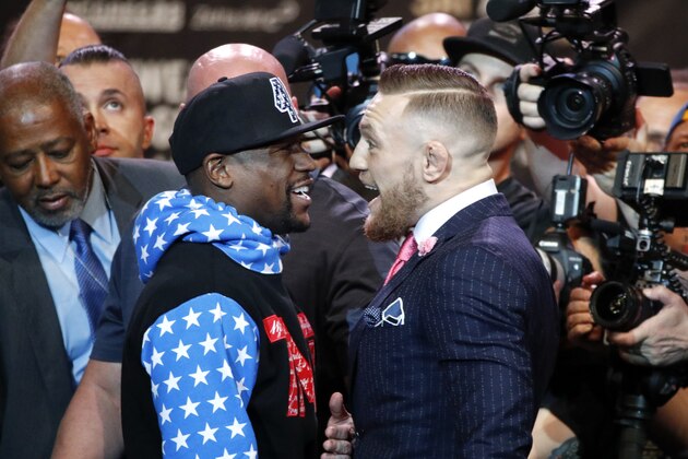 Floyd Mayweather Jr., left, and Conor McGregor exchange words during a news conference at Staples Center Tuesday, July 11, 2017, in Los Angeles. The two will fight in a boxing match in Las Vegas on Aug. 26. (AP Photo/Jae C. Hong) Floyd Mayweather Jr., left, and Conor McGregor exchange words during a news conference at Staples Center Tuesday, July 11, 2017, in Los Angeles. The two will fight in a boxing match in Las Vegas on Aug. 26. (AP Photo/Jae C. Hong)