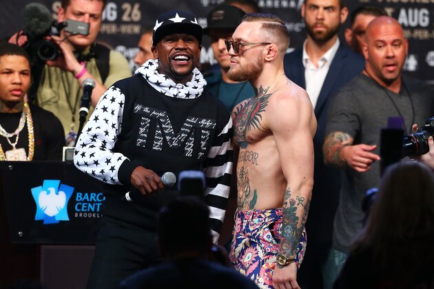 NEW YORK, NY - JULY 13: Floyd Mayweather Jr. speaks as Conor McGregor looks on during the Floyd Mayweather Jr. v Conor McGregor World Press Tour event at Barclays Center on July 13, 2017 in the Brooklyn borough of New York City. (Photo by Mike Stobe/Getty Images) NEW YORK, NY - JULY 13: Floyd Mayweather Jr. speaks as Conor McGregor looks on during the Floyd Mayweather Jr. v Conor McGregor World Press Tour event at Barclays Center on July 13, 2017 in the Brooklyn borough of New York City. (Photo by Mike Stobe/Getty Images)
