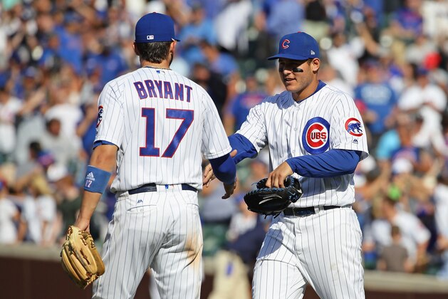 CHICAGO, IL - JULY 07:    Anthony Rizzo #44 of the Chicago Cubs (R) shakes hands with Kris Bryant #17 after a win over the Pittsburgh Pirates at Wrigley Field on July 7, 2017 in Chicago, Illinois. The Cubs defeated the Pirates 6-1. (Photo by Jonathan Daniel/Getty Images)