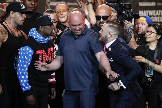 UFC president Dana White, center, intervenes as Floyd Mayweather Jr., left, and Conor McGregor exchange words during a news conference at Staples Center Tuesday, July 11, 2017, in Los Angeles. The two will fight in a boxing match in Las Vegas on Aug. 26. (AP Photo/Jae C. Hong) UFC president Dana White, center, intervenes as Floyd Mayweather Jr., left, and Conor McGregor exchange words during a news conference at Staples Center Tuesday, July 11, 2017, in Los Angeles. The two will fight in a boxing match in Las Vegas on Aug. 26. (AP Photo/Jae C. Hong)