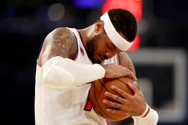 NEW YORK, NY - APRIL 12:  Carmelo Anthony #7 of the New York Knicks hugs the ball before the opening tipoff against the Philadelphia 76ers at Madison Square Garden on April 12, 2017 in New York City. NOTE TO USER: User expressly acknowledges and agrees that, by downloading and or using this Photograph, user is consenting to the terms and conditions of the Getty Images License Agreement  (Photo by Elsa/Getty Images)