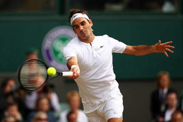 LONDON, ENGLAND - JULY 14:  Roger Federer of Switzerland plays a forehand during the Gentlemen's Singles semi final match against Tomas Berdych of The Czech Republic on day eleven of the Wimbledon Lawn Tennis Championships at the All England Lawn Tennis and Croquet Club at Wimbledon at Wimbledon on July 14, 2017 in London, England.  (Photo by Julian Finney/Getty Images)