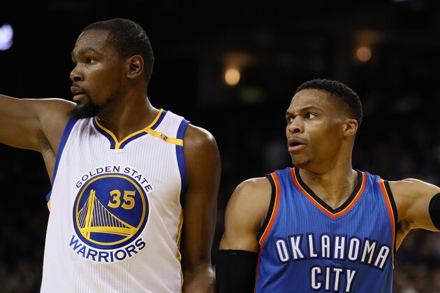OAKLAND, CA - JANUARY 18:  Kevin Durant #35 of the Golden State Warriors and Russell Westbrook #0 of the Oklahoma City Thunder point in different directions after the ball went out of bounds at ORACLE Arena on January 18, 2017 in Oakland, California.  NOTE TO USER: User expressly acknowledges and agrees that, by downloading and or using this photograph, User is consenting to the terms and conditions of the Getty Images License Agreement.  (Photo by Ezra Shaw/Getty Images)