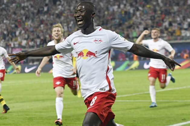 Leipzig's Naby Keita celebrates scoring against Borussia Dortmund during the German first division Bundesliga soccer match between RB Leipzig and Borussia Dortmund in Leipzig, Germany, Saturday, Sept. 10, 2016. Leipzig won by 1-0. (AP Photo/Jens Meyer)