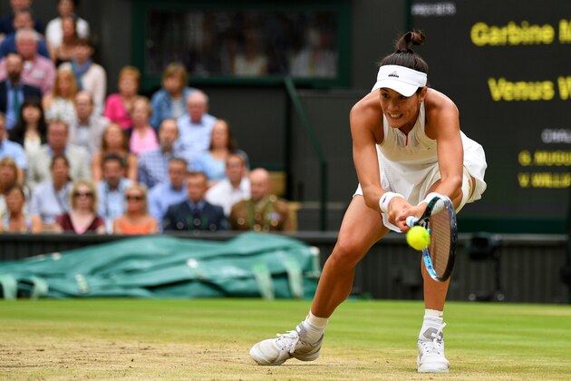 LONDON, ENGLAND - JULY 15:  Garbine Muguruza of Spain plays a backhand during the Ladies Singles final against Venus Williams of The United States on day twelve of the Wimbledon Lawn Tennis Championships at the All England Lawn Tennis and Croquet Club at Wimbledon on July 15, 2017 in London, England.  (Photo by David Ramos/Getty Images)