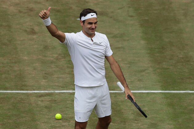 Switzerland's Roger Federer celebrates after winning against Czech Republic's Tomas Berdych during their men's singles semi-final match on the eleventh day of the 2017 Wimbledon Championships at The All England Lawn Tennis Club in Wimbledon, southwest London, on July 14, 2017.
Federer won the match 7-6, 7-6, 6-4. / AFP PHOTO / POOL / Tim IRELAND / RESTRICTED TO EDITORIAL USE        (Photo credit should read TIM IRELAND/AFP/Getty Images)
