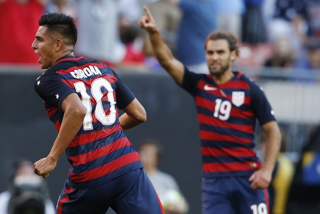 United States' Joe Corona (10) celebrates with Graham Zusi (19) after scoring a goal against Nicaragua during a CONCACAF Gold Cup soccer match in Cleveland, Ohio, Saturday, July 15, 2017. (AP Photo/Ron Schwane)