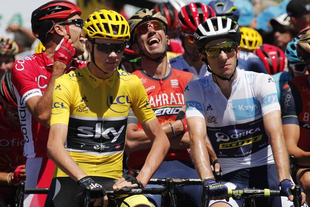 Britain's Chris Froome, wearing the overall leader's yellow jersey, and Britain's Simon Yates, wearing the best young rider's white jersey, wait for the start of the fifteenth stage of the Tour de France cycling race over 189.5 kilometers (117.8 miles) with start in Laissac-Severac l'Eglise and finish in Le Puy-en-Velay, France, Sunday, July 16, 2017. (AP Photo/Christophe Ena) Britain's Chris Froome, wearing the overall leader's yellow jersey, and Britain's Simon Yates, wearing the best young rider's white jersey, wait for the start of the fifteenth stage of the Tour de France cycling race over 189.5 kilometers (117.8 miles) with start in Laissac-Severac l'Eglise and finish in Le Puy-en-Velay, France, Sunday, July 16, 2017. (AP Photo/Christophe Ena)