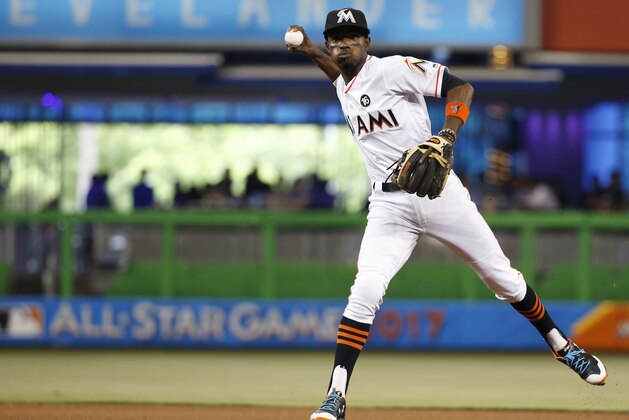 Miami Marlins second baseman Dee Gordon throws to first to put out Washington Nationals' Brian Goodwin during the fourth inning of a baseball game, Wednesday, June 21, 2017, in Miami. (AP Photo/Wilfredo Lee)