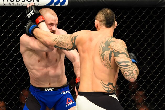 GLASGOW, SCOTLAND - JULY 16:  (R-L) Santiago Ponzinibbio of Argentina punches Gunnar Nelson of Iceland in their welterweight bout during the UFC Fight Night event at the SSE Hydro Arena Glasgow on July 16, 2017 in Glasgow, Scotland. (Photo by Josh Hedges/Zuffa LLC/Zuffa LLC via Getty Images)