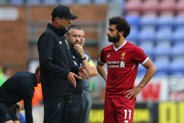 WIGAN, ENGLAND - JULY 14:  Jurgen Klopp the manager of Liverpool talks with Mohamed Salah of Liverpool during the pre-season friendly match between Wigan Athletic and Liverpool at DW Stadium on July 14, 2017 in Wigan, England.  (Photo by Alex Livesey/Getty Images)