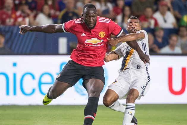 CARSON, CA - JULY 15: Romelu Lukaku #9 of Manchester United battles Ashley Cole #3 of Los Angeles Galaxy during the Los Angeles Galaxy's friendly match against Manchester United at the StubHub Center on July 15, 2017 in Carson, California. Manchester United won the match 5-2. (Photo by Shaun Clark/Getty Images) CARSON, CA - JULY 15: Romelu Lukaku #9 of Manchester United battles Ashley Cole #3 of Los Angeles Galaxy during the Los Angeles Galaxy's friendly match against Manchester United at the StubHub Center on July 15, 2017 in Carson, California. Manchester United won the match 5-2. (Photo by Shaun Clark/Getty Images)