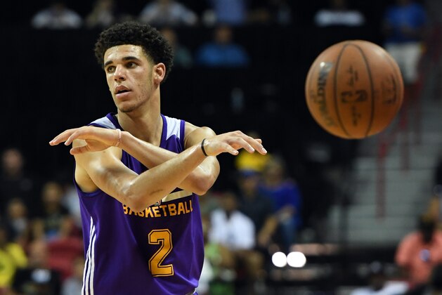 LAS VEGAS, NV - JULY 16:  Lonzo Ball #2 of the Los Angeles Lakers throws a no-look pass against the Dallas Mavericks during a semifinal game of the 2017 Summer League at the Thomas & Mack Center on July 16, 2017 in Las Vegas, Nevada. Los Angeles won 108-98. NOTE TO USER: User expressly acknowledges and agrees that, by downloading and or using this photograph, User is consenting to the terms and conditions of the Getty Images License Agreement.  (Photo by Ethan Miller/Getty Images)