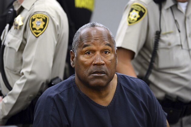 FILE - In this May 14, 2013 pool file photo, O.J. Simpson sits during a break on the second day of an evidentiary hearing in Clark County District Court in Las Vegas. Simpson, the former football star, TV pitchman and now Nevada prison inmate, will have a lot going for him when he appears before state parole board members Thursday, July 20, 2017 seeking his release after more than eight years for an ill-fated bid to retrieve sports memorabilia. (AP Photo/Ethan Miller, Pool, File)
