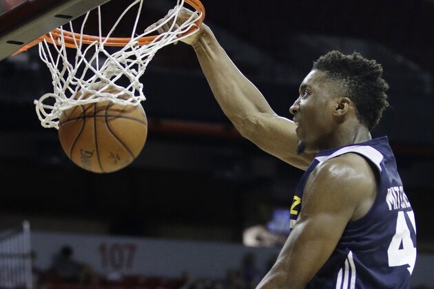 Utah Jazz's Donovan Mitchell dunks against the Memphis Grizzlies during the second half of an NBA summer league basketball game, Tuesday, July 11, 2017, in Las Vegas. (AP Photo/John Locher)