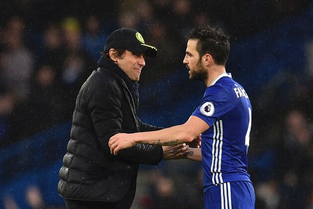Chelsea's Italian head coach Antonio Conte (L) shakes hands with Chelsea's Spanish midfielder Cesc Fabregas (R) on the pitch at the end of the English Premier League football match between Chelsea and Swansea at Stamford Bridge in London on February 25, 2017. / AFP / Glyn KIRK / RESTRICTED TO EDITORIAL USE. No use with unauthorized audio, video, data, fixture lists, club/league logos or 'live' services. Online in-match use limited to 75 images, no video emulation. No use in betting, games or single club/league/player publications.  /         (Photo credit should read GLYN KIRK/AFP/Getty Images)