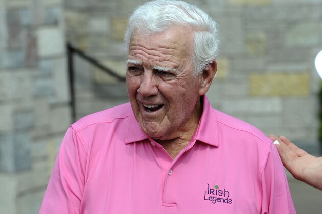 FILE - In this June 12, 2013, file photo, former Notre Dame football coach Ara Parseghian talks with golfers at the Legends golf outing in Bridgman, Mich. Parseghian still bristles 50 years later at the notion No. 1 Notre Dame played for a tie against No. 2 Michigan State in one of the most famous games in college football history.  (AP Photo/Joe Raymond, File)