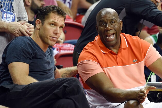 LAS VEGAS, NV - JULY 16:  Head coach Luke Walton (L) of the Los Angeles Lakers and Lakers president of basketball operations Earvin 'Magic' Johnson talk courtside during the team's semifinal game of the 2017 Summer League against the Dallas Mavericks at the Thomas & Mack Center on July 16, 2017 in Las Vegas, Nevada. Los Angeles won 108-98. NOTE TO USER: User expressly acknowledges and agrees that, by downloading and or using this photograph, User is consenting to the terms and conditions of the Getty Images License Agreement.  (Photo by Ethan Miller/Getty Images)