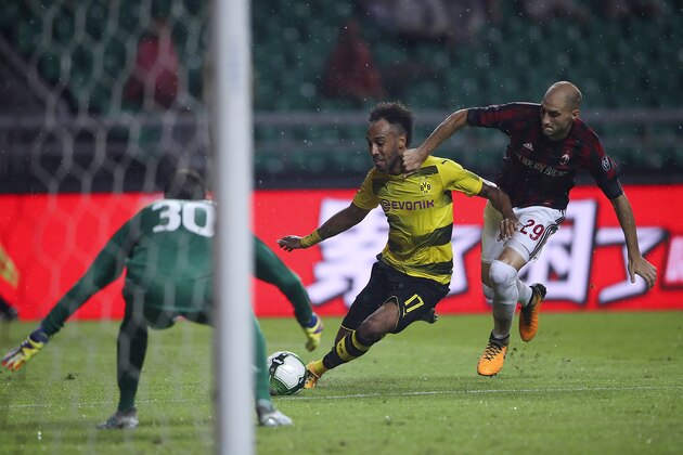 GUANGZHOU, CHINA - JULY 18:  Pierre-Emerick Aubameyang of Borussia Dortmund competes for the ball with  Gabriel Paletta and Marco Storari of AC Milan during the 2017 International Champions Cup football match between AC milan and Borussia Dortmund at University Town Sports Centre Stadium on July 18, 2017 in Guangzhou, China.  (Photo by Lintao Zhang/Getty Images)