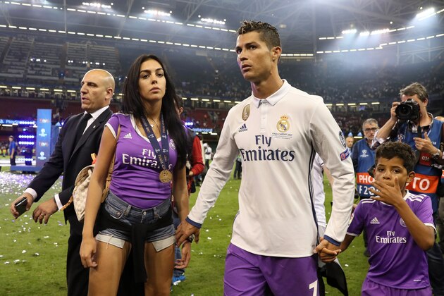 CARDIFF, WALES - JUNE 03:  Cristiano Ronaldo of Real Madrid walks with girlfriend Georgina Rodriguez and son Cristiano Jnr at the end of the UEFA Champions League Final between Juventus and Real Madrid at National Stadium of Wales on June 3, 2017 in Cardiff, Wales.  (Photo by Matthew Ashton - AMA/Getty Images)
