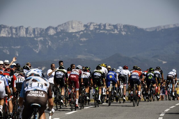 The pack rides during the 165 km sixteenth stage of the 104th edition of the Tour de France cycling race on July 18, 2017 between Le Puy-en-Velay and Romans-sur-Isere. / AFP PHOTO / POOL / Jeff PACHOUD (Photo credit should read JEFF PACHOUD/AFP/Getty Images) The pack rides during the 165 km sixteenth stage of the 104th edition of the Tour de France cycling race on July 18, 2017 between Le Puy-en-Velay and Romans-sur-Isere. / AFP PHOTO / POOL / Jeff PACHOUD (Photo credit should read JEFF PACHOUD/AFP/Getty Images)