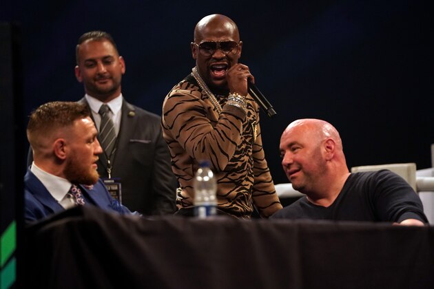 LONDON, ENGLAND - JULY 14:  (R-L) Floyd Mayweather Jr. speaks to Conor McGregor during the Floyd Mayweather Jr. v Conor McGregor World Press Tour event at SSE Arena on July 14, 2017 in London, England. (Photo by Jeff Bottari/Zuffa LLC/Zuffa LLC via Getty Images)