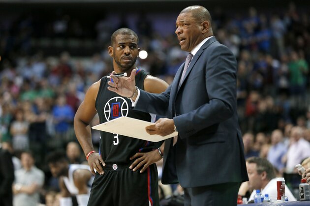 Los Angeles Clippers guard Chris Paul (3) takes instruction from head coach Doc Rivers in the second half of an NBA basketball game against the Dallas Mavericks in Dallas, Thursday, March 23, 2017. (AP Photo/Tony Gutierrez)