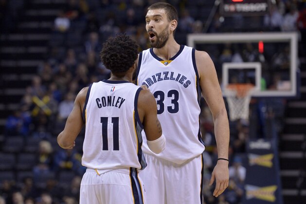 Memphis Grizzlies guard Mike Conley (11) and center Marc Gasol (33) stand on the court between plays during the first half of the team's NBA basketball game against the Sacramento Kings on Friday, Jan. 20, 2017, in Memphis, Tenn. (AP Photo/Brandon Dill)