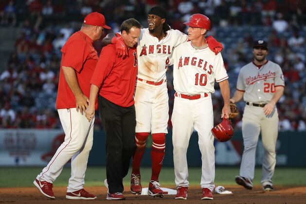 Los Angeles Angels' Cameron Maybin, center, is helped off the field after being injured sliding into second during the first inning of the team's baseball game against the Washington Nationals in Anaheim, Calif., Tuesday, July 18, 2017. (AP Photo/Chris Carlson) Los Angeles Angels' Cameron Maybin, center, is helped off the field after being injured sliding into second during the first inning of the team's baseball game against the Washington Nationals in Anaheim, Calif., Tuesday, July 18, 2017. (AP Photo/Chris Carlson)